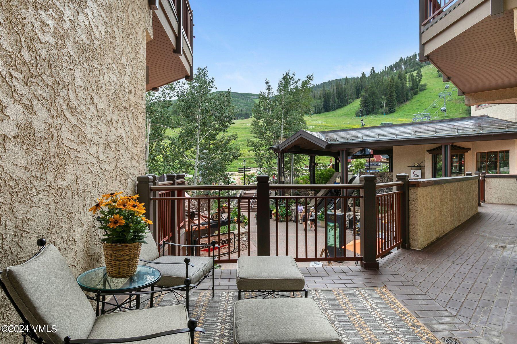 15 West Thomas Place, Unit R44 Beaver Creek, CO 81620 - Photo 12 of 21 a view of a patio with table and chairs and potted plants