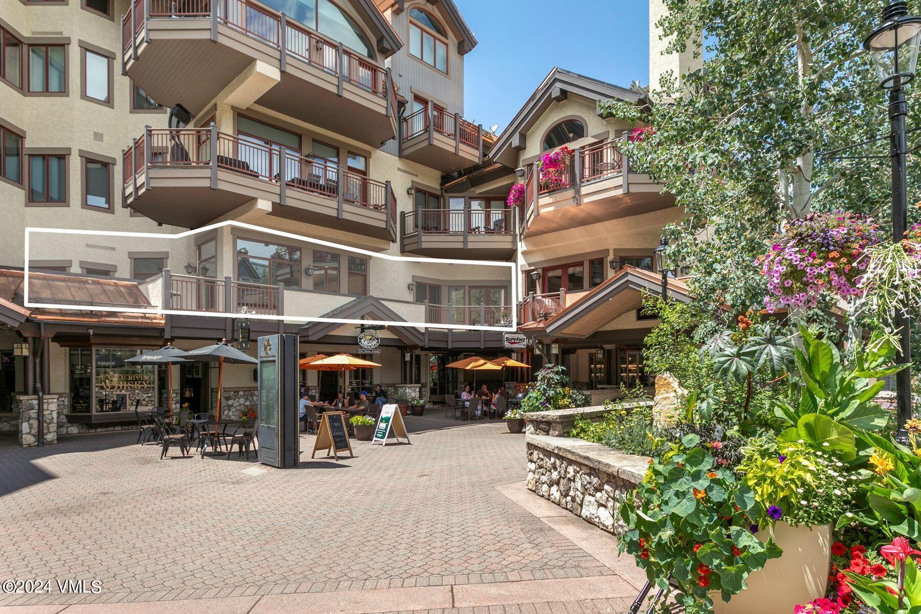 15 West Thomas Place, Unit R44 Beaver Creek, CO 81620 - Photo 19 of 21 a front view of a building with street view and trees