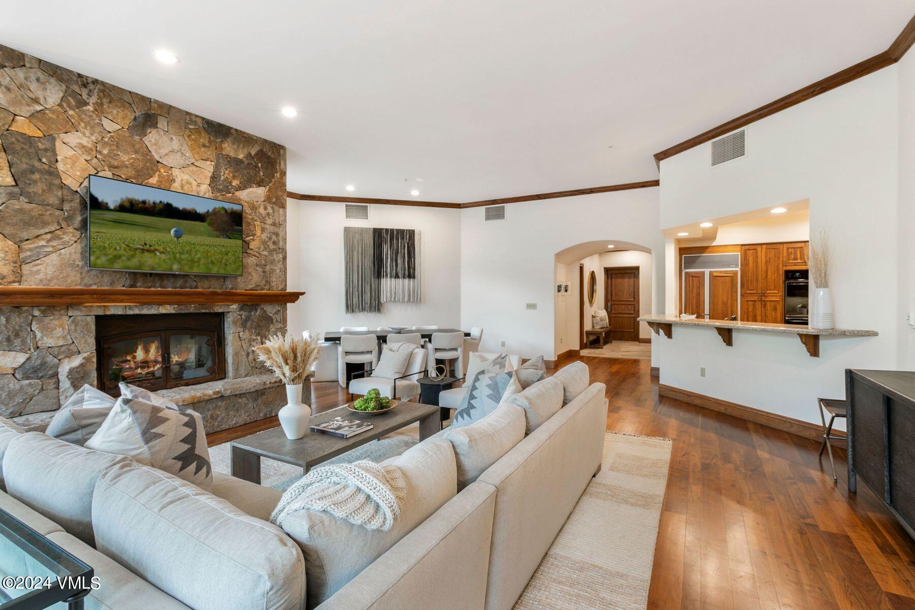 15 West Thomas Place, Unit R44 Beaver Creek, CO 81620 - Photo 3 of 21 a living room with furniture and a fireplace