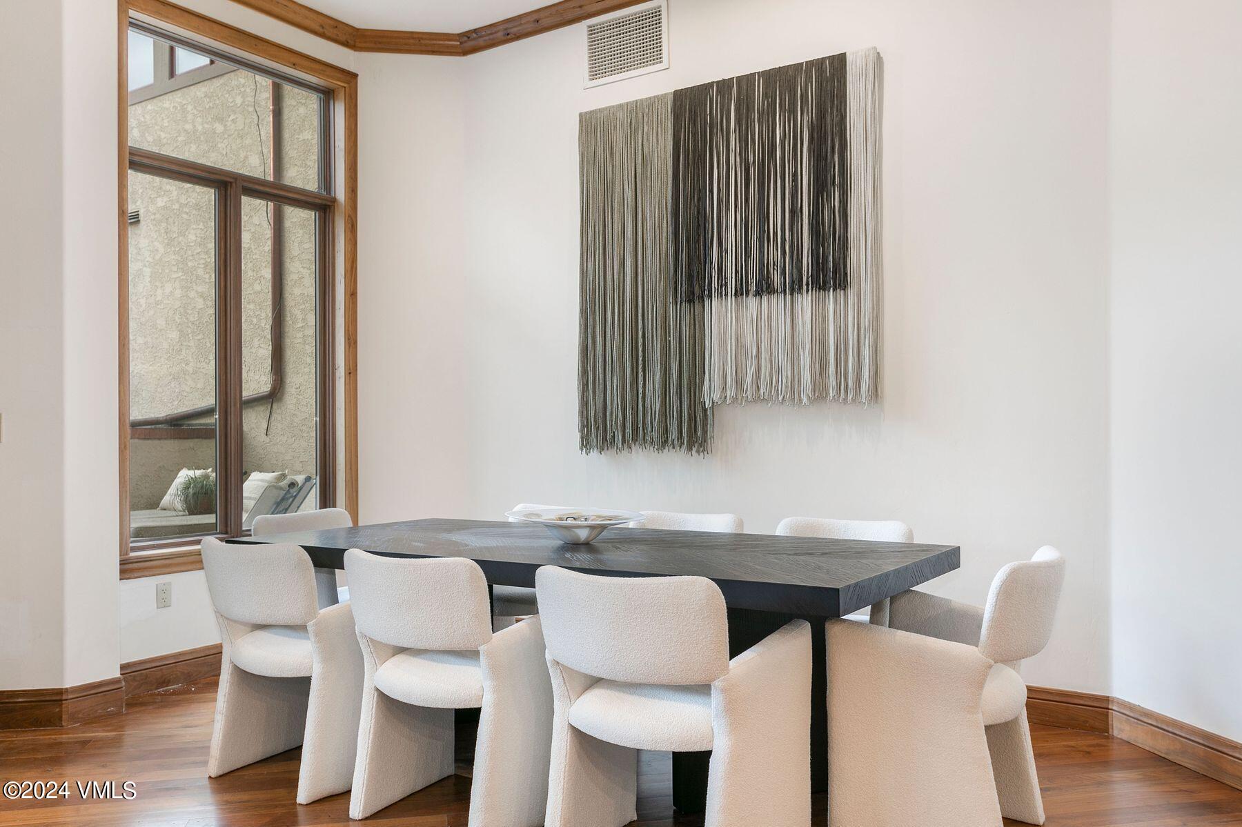 15 West Thomas Place, Unit R44 Beaver Creek, CO 81620 - Photo 4 of 21 a view of a dining room with furniture and wooden floor