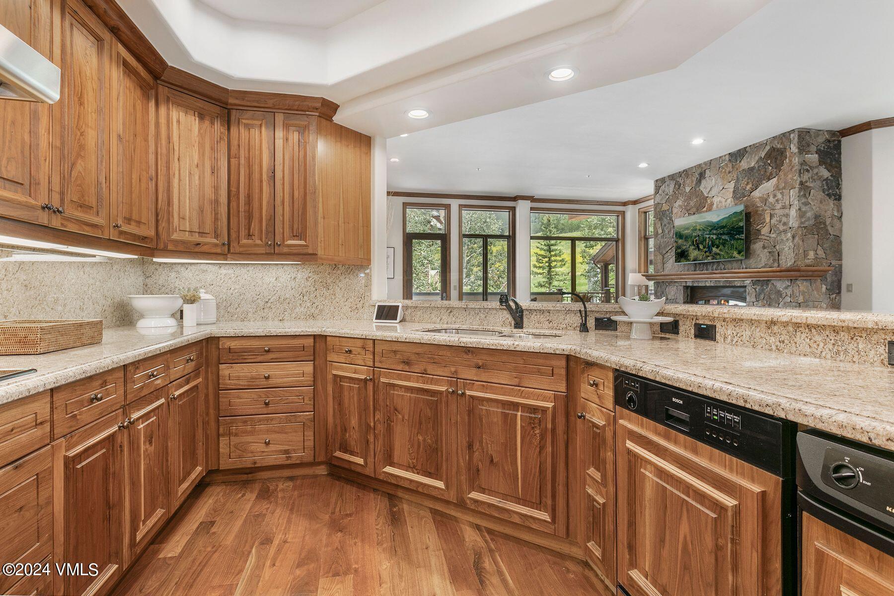15 West Thomas Place, Unit R44 Beaver Creek, CO 81620 - Photo 6 of 21 a kitchen with a sink windows and cabinets