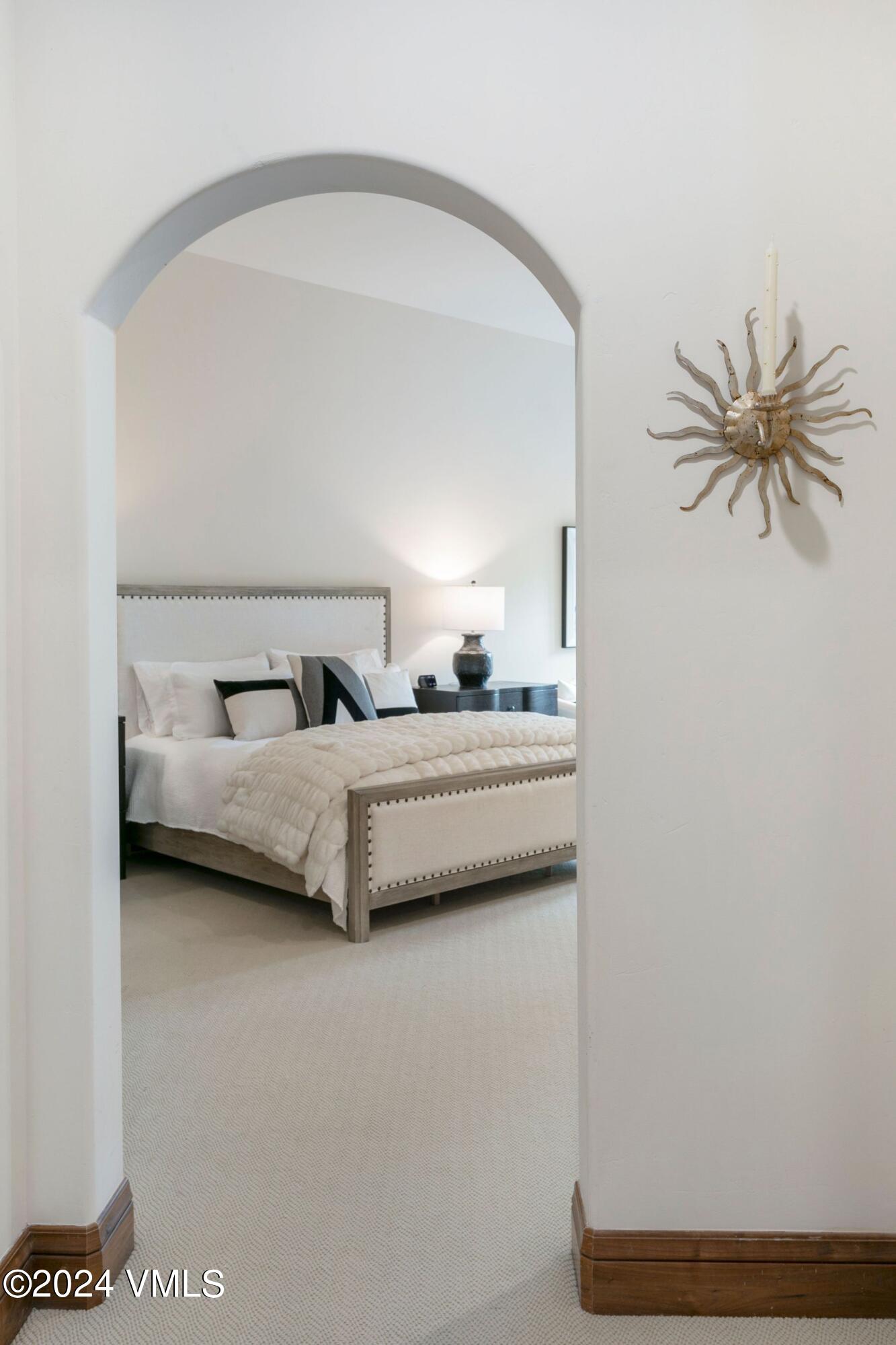 15 West Thomas Place, Unit R44 Beaver Creek, CO 81620 - Photo 7 of 21 a bedroom with a bed and a window