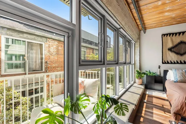 a view of balcony with furniture