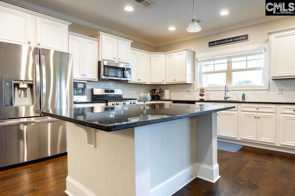 357 Cabana Way Lexington, SC 29072 - Photo 7 of 25 a kitchen with stainless steel appliances a sink stove refrigerator and cabinets
