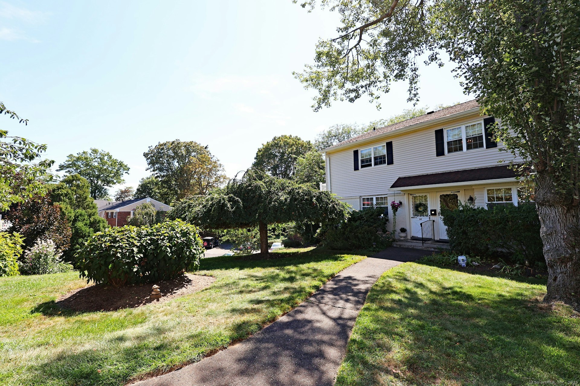 a front view of a house with a yard