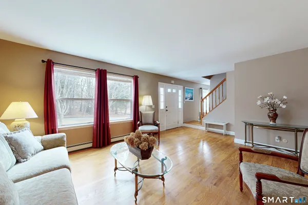 a living room with furniture and a large window