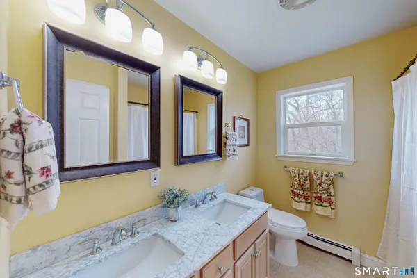 a bedroom with a bed and a mirror