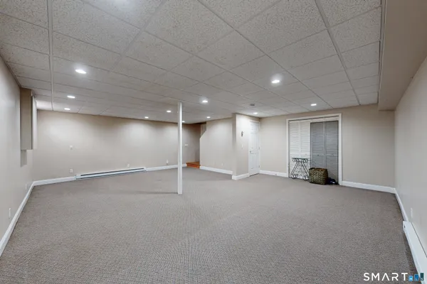 an empty room with a wooden & door