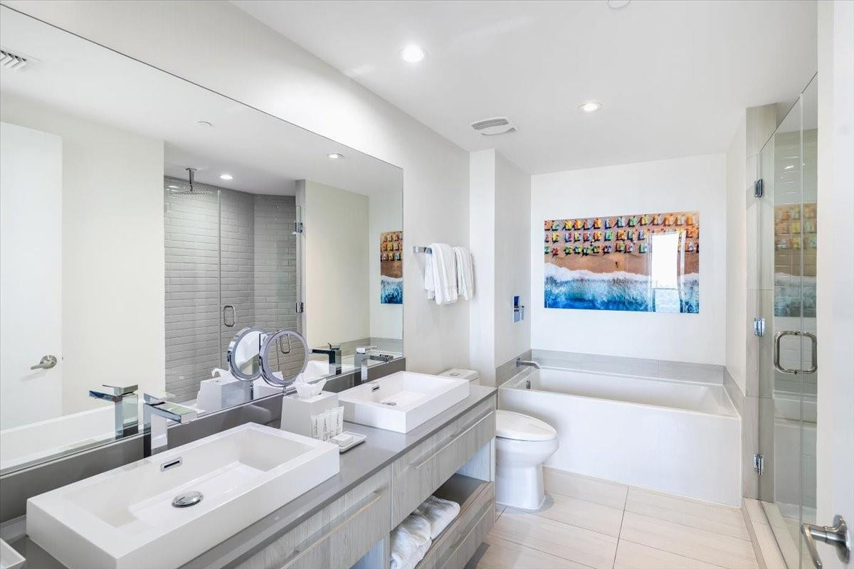 4010 South Ocean Drive, Unit R1102 Hollywood, FL 33019 - Photo 24 of 47 a bathroom with a double vanity sink toilet and shower