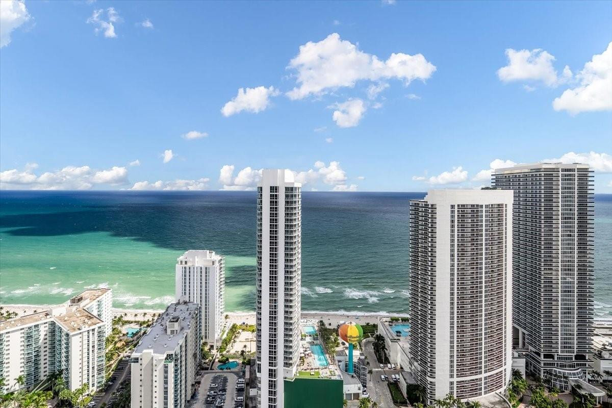 4010 South Ocean Drive, Unit R1102 Hollywood, FL 33019 - Photo 3 of 47 a view of a city with tall buildings