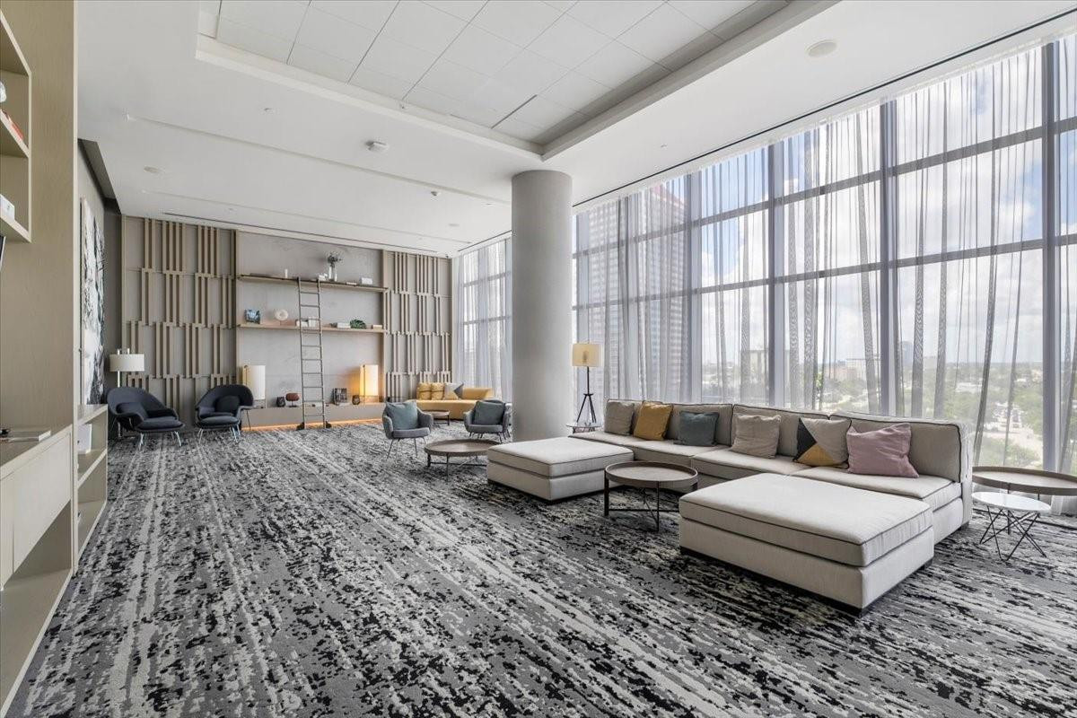 4010 South Ocean Drive, Unit R1102 Hollywood, FL 33019 - Photo 38 of 47 a living room with furniture and large windows