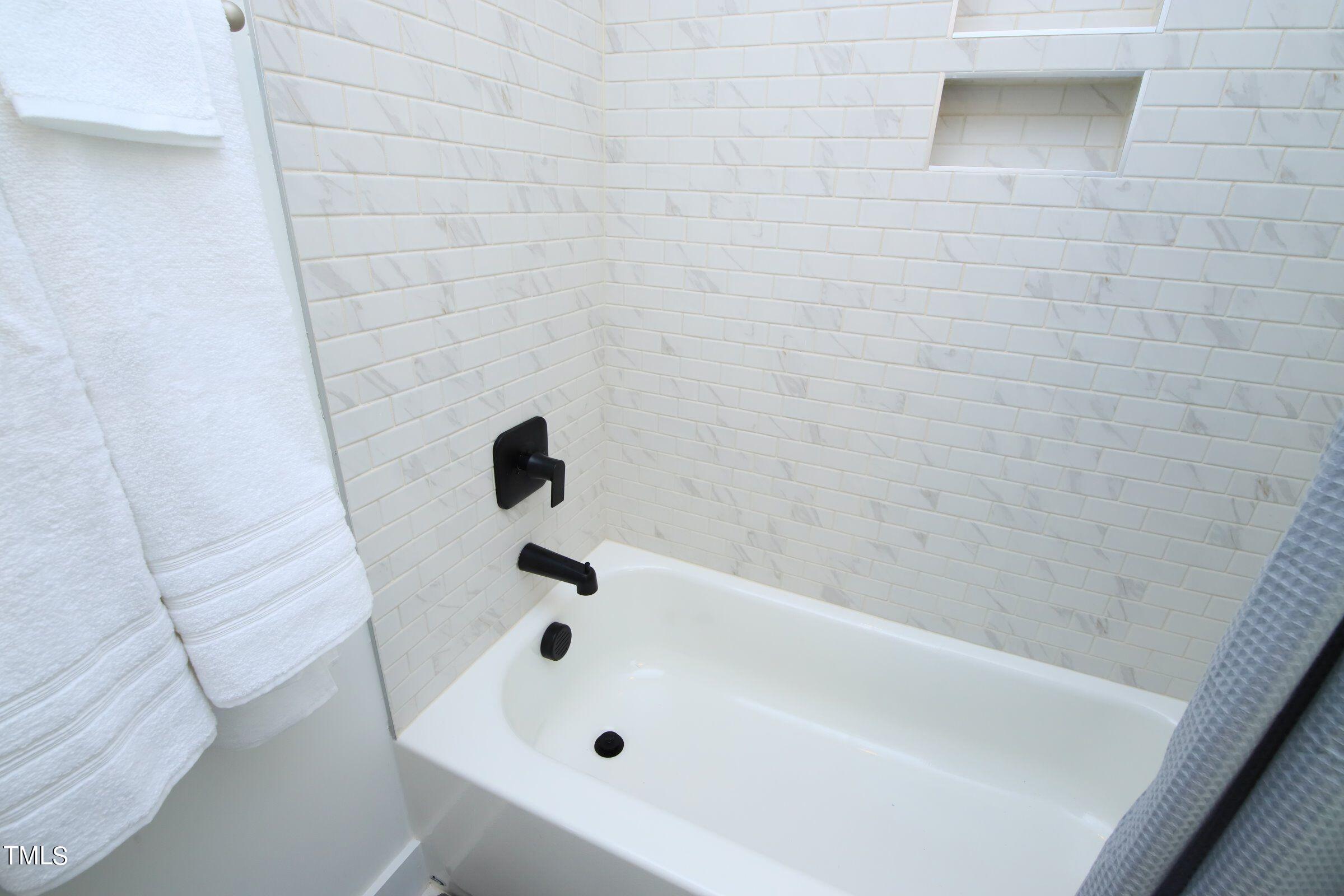 417 Como Drive Raleigh, NC 27610 - Photo 13 of 19 a bathroom with a bathtub