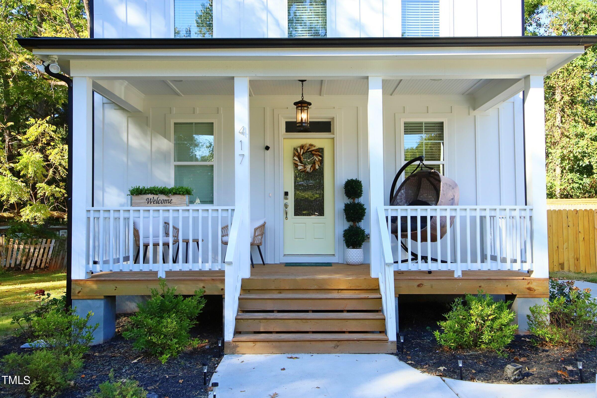 417 Como Drive Raleigh, NC 27610 - Photo 16 of 19 a view of a house with a deck and furniture