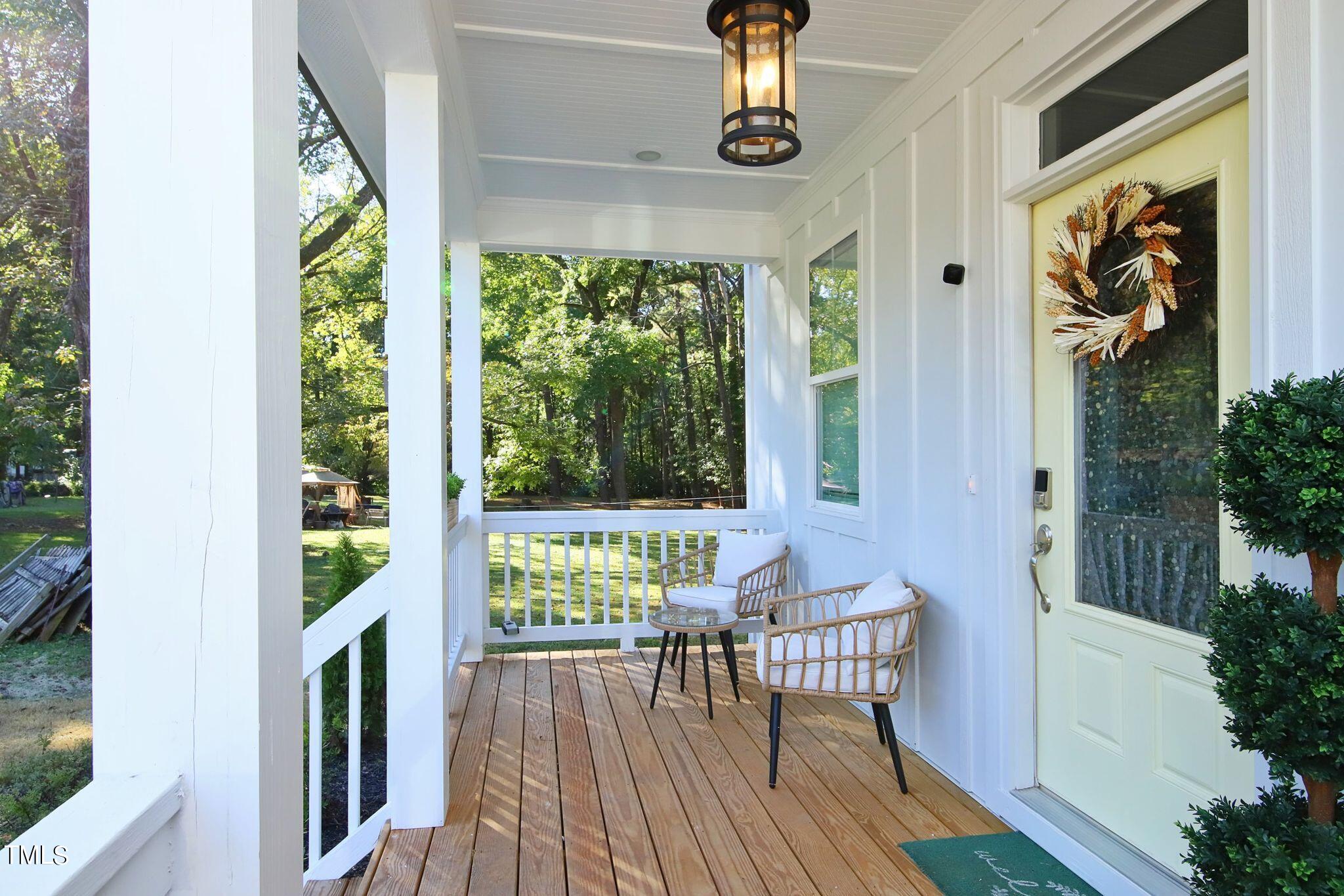 417 Como Drive Raleigh, NC 27610 - Photo 2 of 19 a view of a porch with furniture and garden