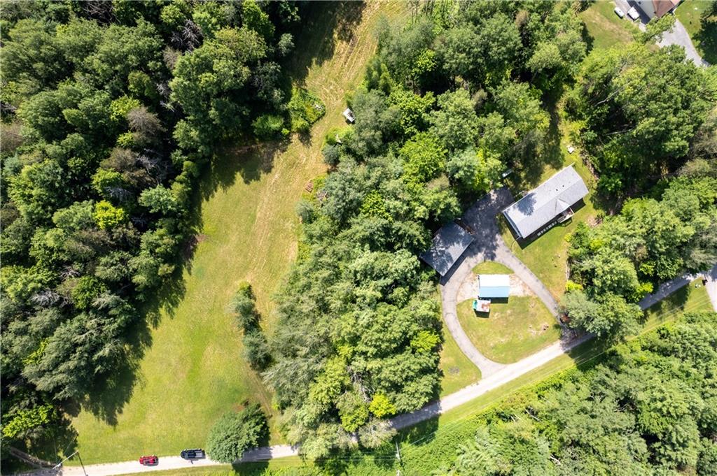 580 Gameland Road Polk, PA 16342 - Photo 24 of 25 an aerial view of a house with swimming pool and large trees