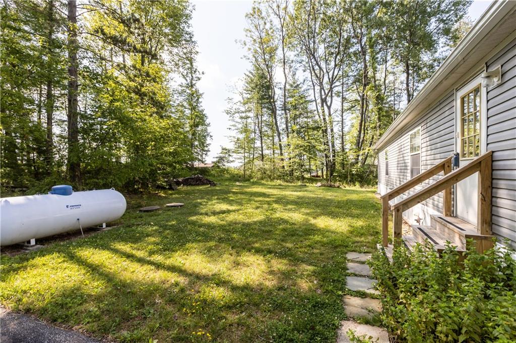 580 Gameland Road Polk, PA 16342 - Photo 3 of 25 a view of a swimming pool with a yard and plants