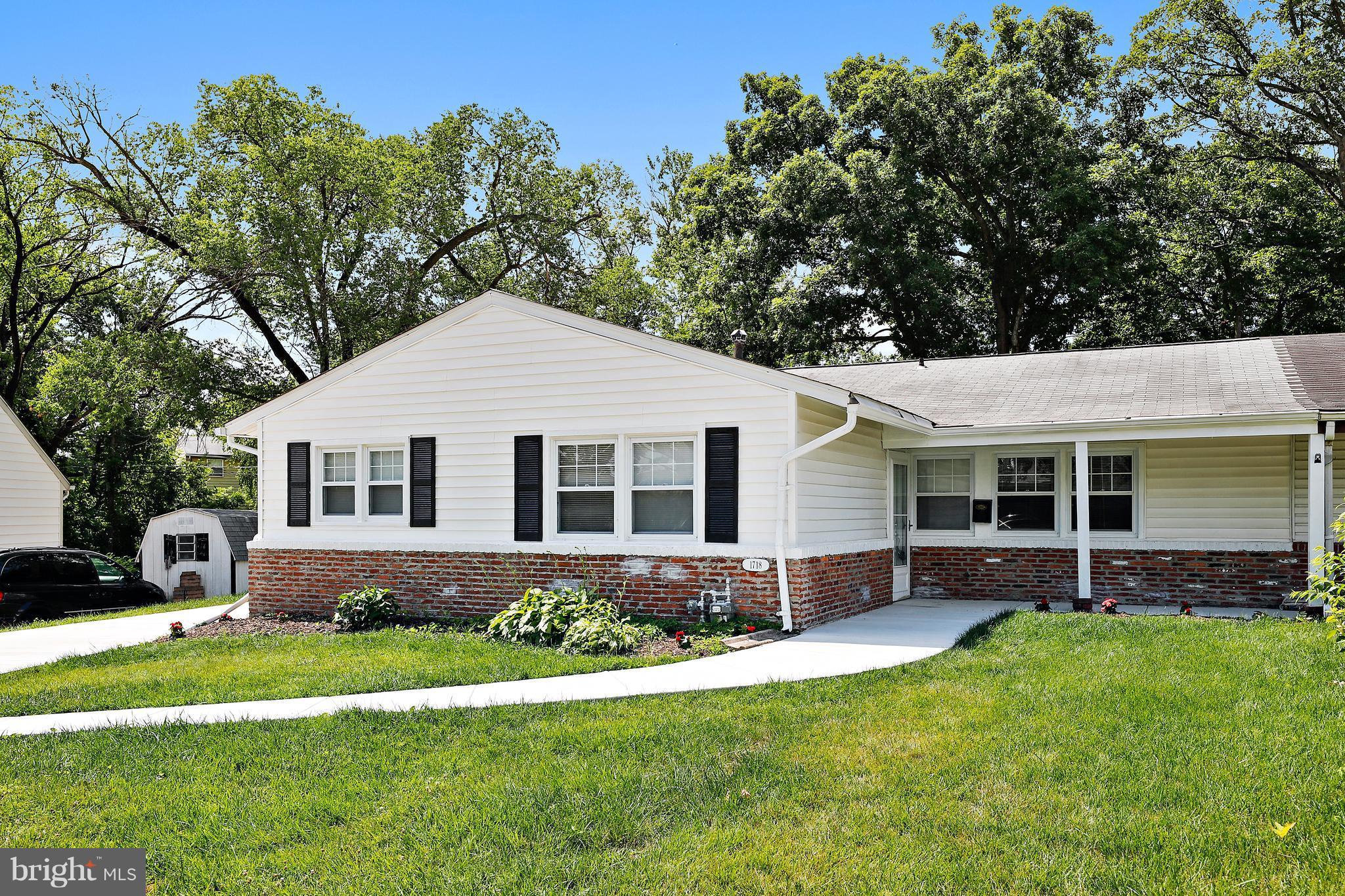 1718 Newcastle Road Baltimore, MD 21244 - Photo 1 of 9 a front view of house with a garden and patio