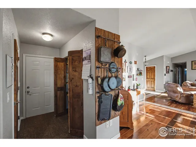 a bedroom with bed and wooden floor