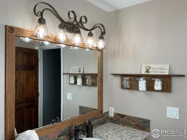 a view of a house with a snow in the background