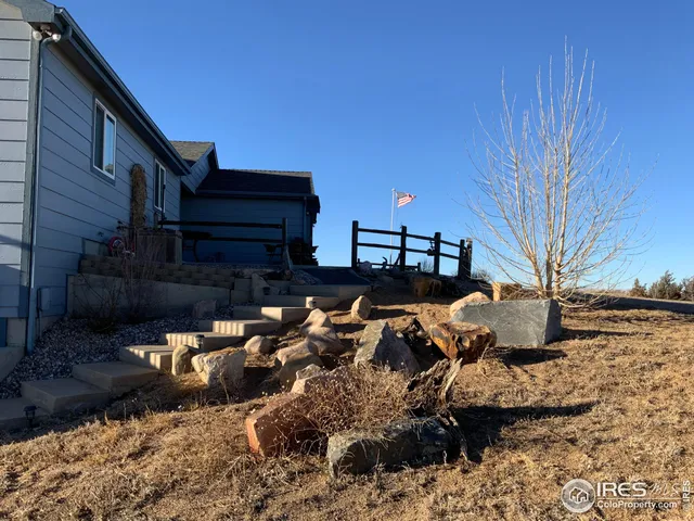 a kitchen with stainless steel appliances granite countertop a sink refrigerator stove and microwave