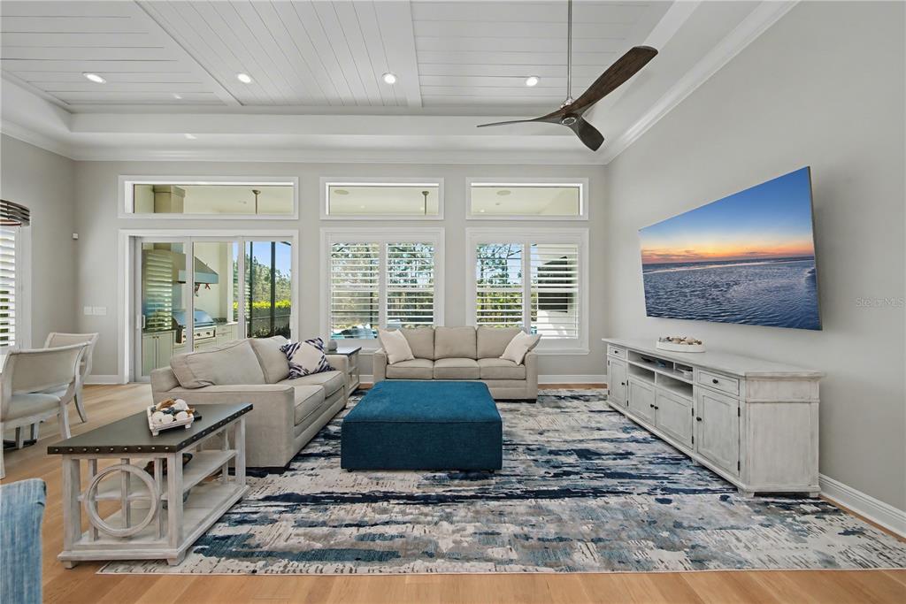 16620 Collingtree Crossing Lakewood Ranch, FL 34202 - Photo 12 of 48 a living room with furniture and a flat screen tv