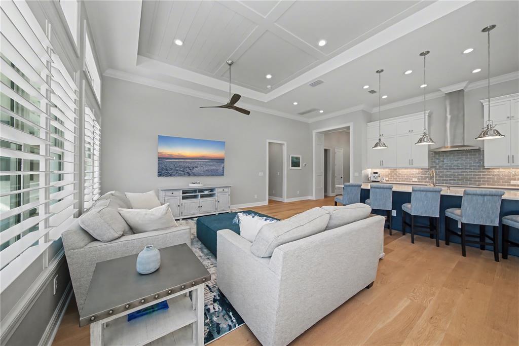 16620 Collingtree Crossing Lakewood Ranch, FL 34202 - Photo 13 of 48 a living room with furniture kitchen view and a large window