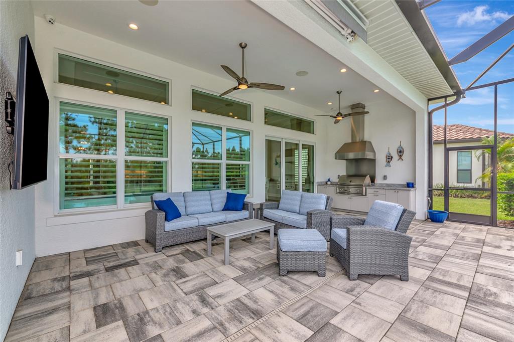16620 Collingtree Crossing Lakewood Ranch, FL 34202 - Photo 15 of 48 a living room with furniture and a large window