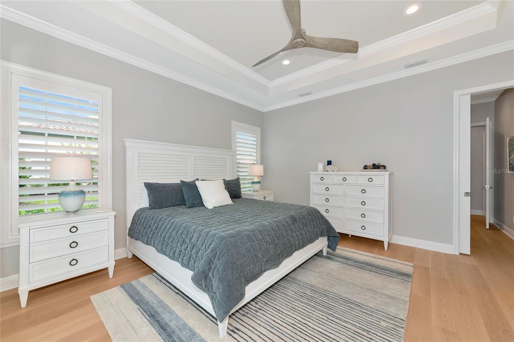 16620 Collingtree Crossing Lakewood Ranch, FL 34202 - Photo 18 of 48 a bedroom with a bed and a dresser