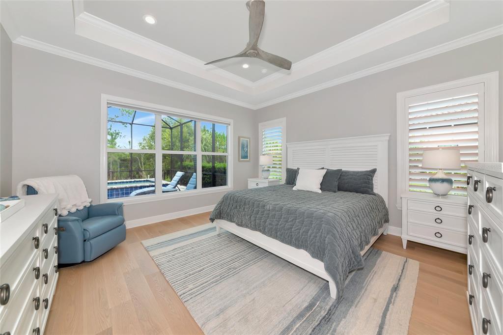 16620 Collingtree Crossing Lakewood Ranch, FL 34202 - Photo 19 of 48 a spacious bedroom with a large bed and a window