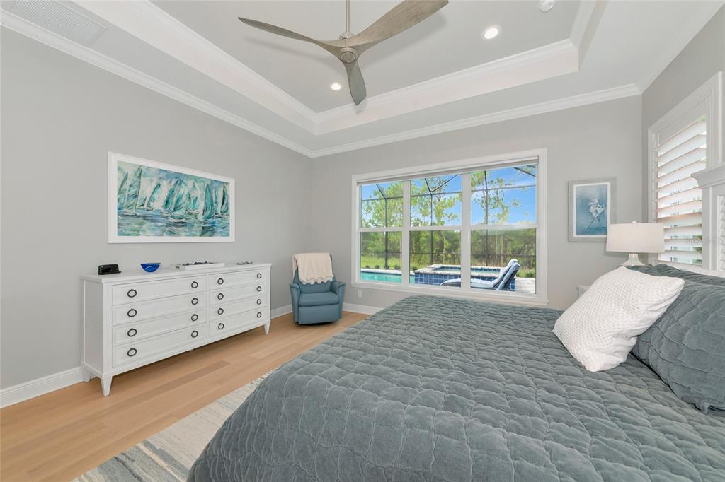 16620 Collingtree Crossing Lakewood Ranch, FL 34202 - Photo 20 of 48 a bed room with a bed and a window