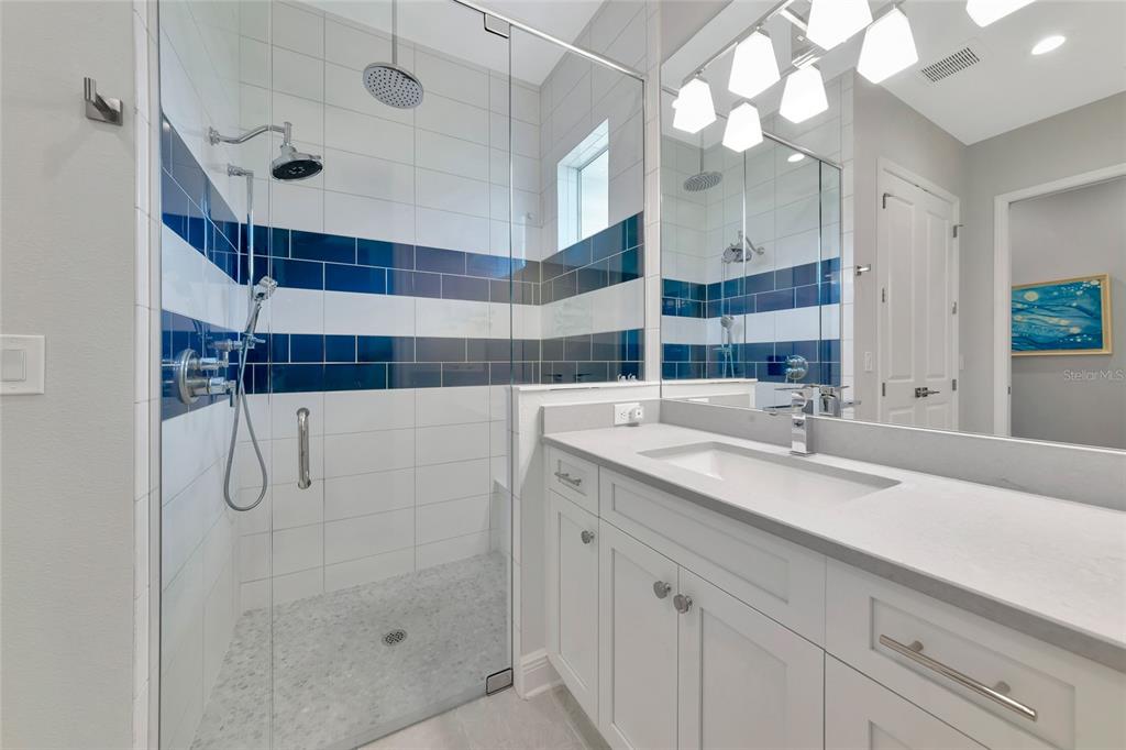16620 Collingtree Crossing Lakewood Ranch, FL 34202 - Photo 21 of 48 a bathroom with a sink and a mirror