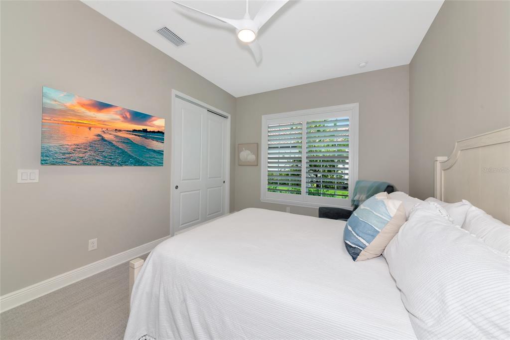 16620 Collingtree Crossing Lakewood Ranch, FL 34202 - Photo 26 of 48 a bedroom with a bed and a painting on the wall
