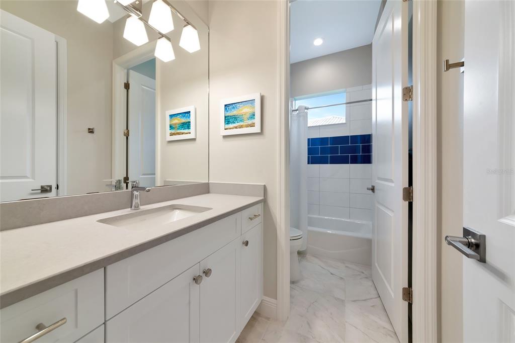 16620 Collingtree Crossing Lakewood Ranch, FL 34202 - Photo 27 of 48 a bathroom with a sink and a mirror