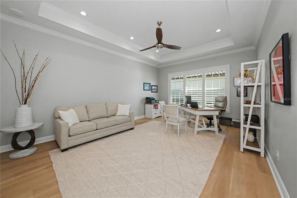 16620 Collingtree Crossing Lakewood Ranch, FL 34202 - Photo 31 of 48 a living room with furniture and a window