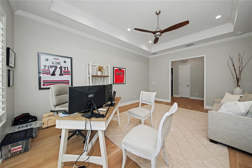 16620 Collingtree Crossing Lakewood Ranch, FL 34202 - Photo 32 of 48 a work room with furniture and a ceiling fan
