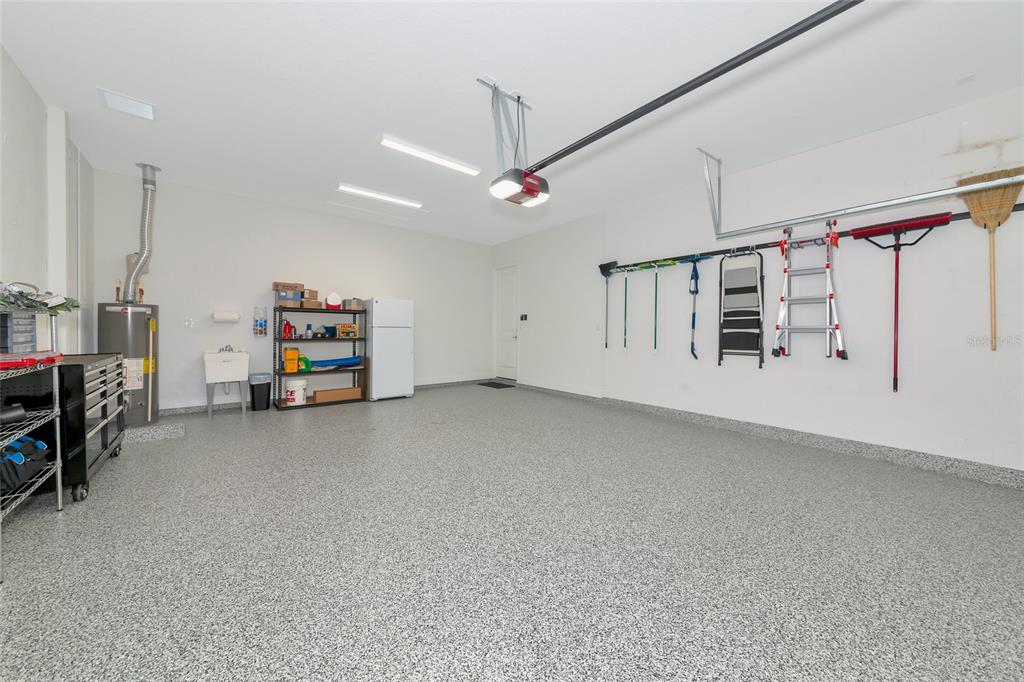 16620 Collingtree Crossing Lakewood Ranch, FL 34202 - Photo 35 of 48 a view of a garage with furniture