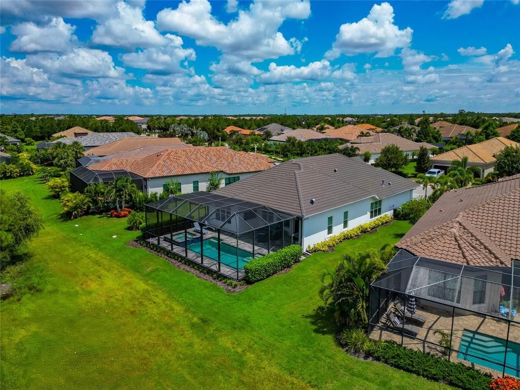 16620 Collingtree Crossing Lakewood Ranch, FL 34202 - Photo 42 of 48 an aerial view of a house with a garden