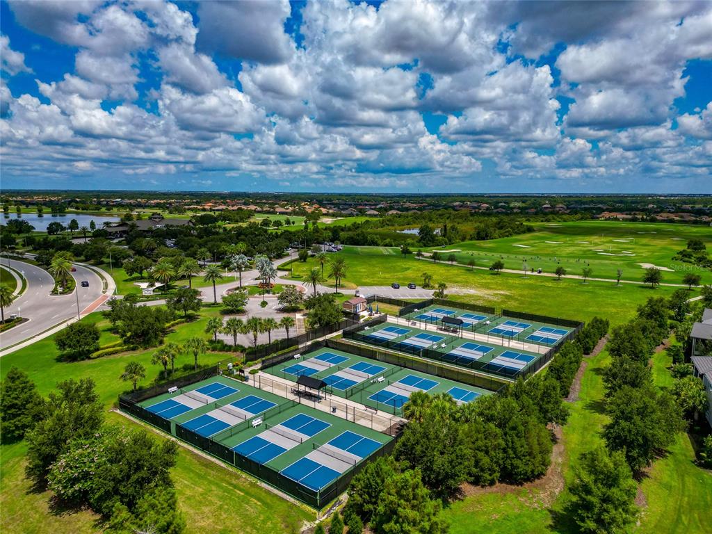 16620 Collingtree Crossing Lakewood Ranch, FL 34202 - Photo 47 of 48 a view of a pool with lawn chairs and a yard