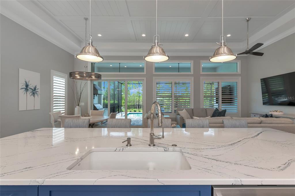 16620 Collingtree Crossing Lakewood Ranch, FL 34202 - Photo 8 of 48 a large living room with a large window and flat screen tv