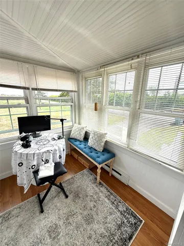 a living room with furniture fireplace and a table
