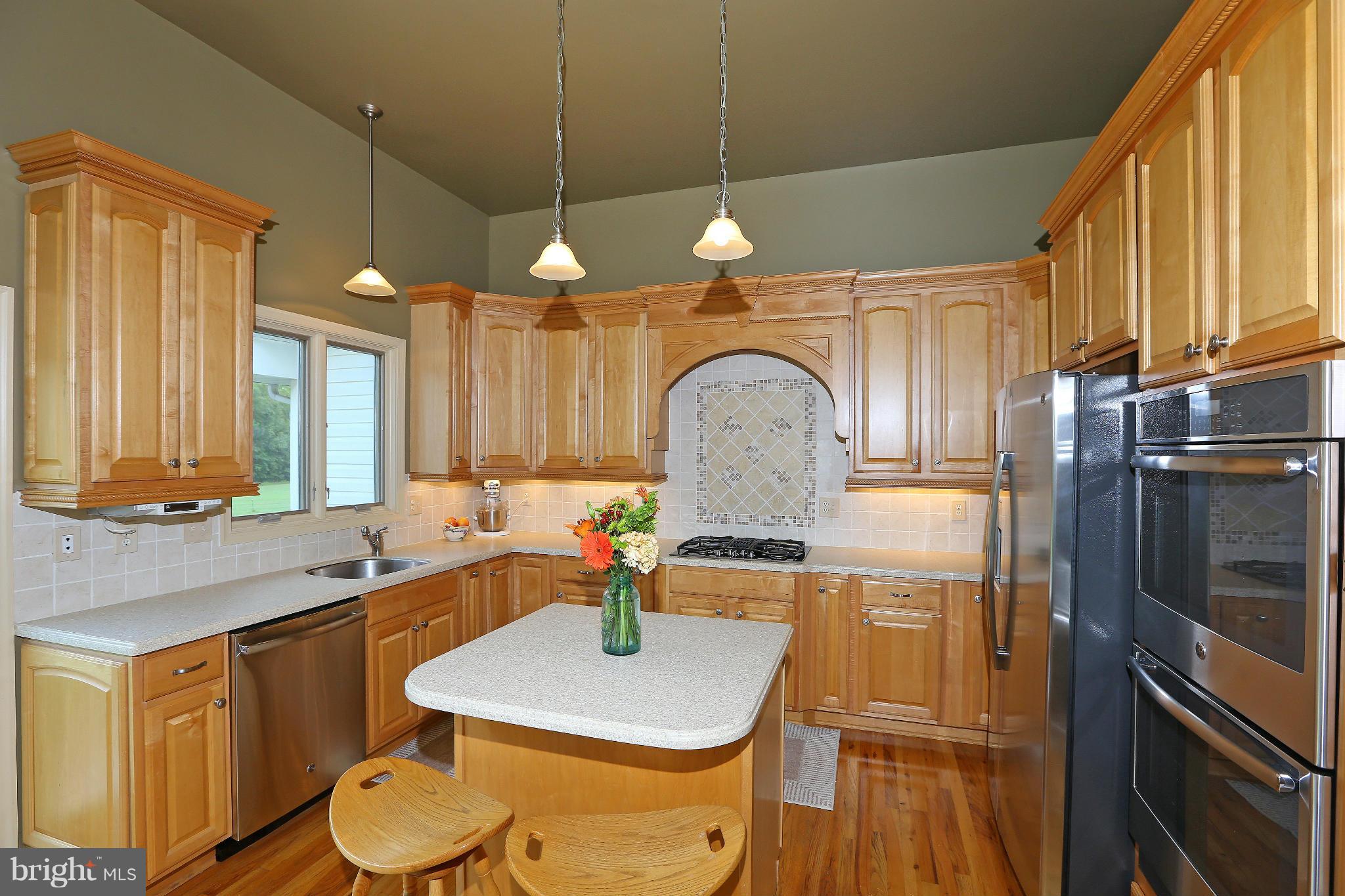 9360 Slate Quarry Road Dickerson, MD 20842 - Photo 11 of 27 a kitchen with stainless steel appliances a sink a stove a refrigerator cabinets and dining table