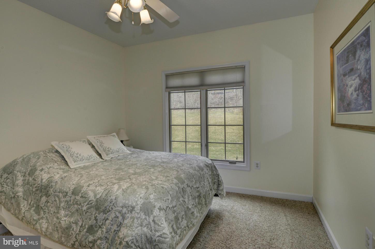 9360 Slate Quarry Road Dickerson, MD 20842 - Photo 12 of 27 a bedroom with a bed and a window