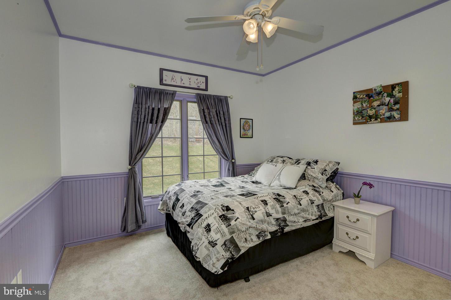 9360 Slate Quarry Road Dickerson, MD 20842 - Photo 18 of 27 a bed sitting in a bedroom next to a window