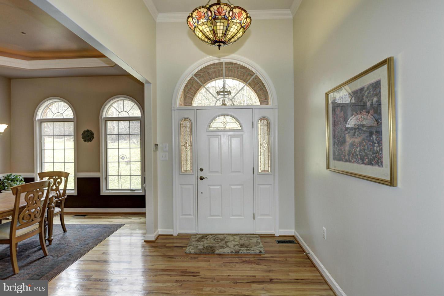 9360 Slate Quarry Road Dickerson, MD 20842 - Photo 3 of 27 a view of a hallway with wooden floor and a livingroom