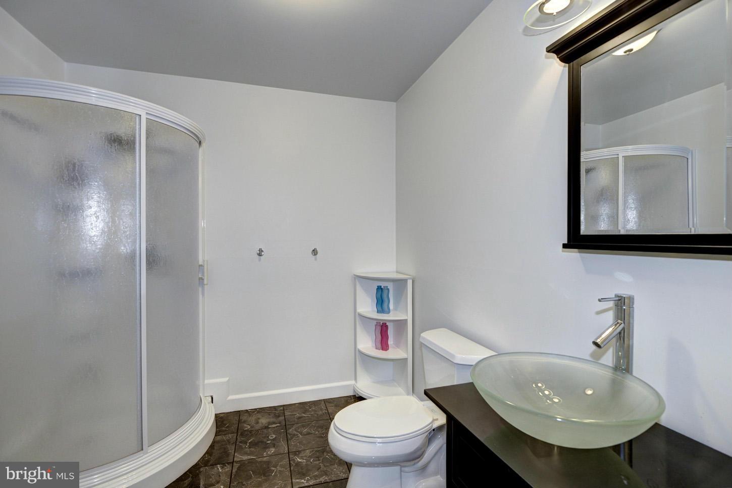 9360 Slate Quarry Road Dickerson, MD 20842 - Photo 22 of 27 a bathroom with a sink toilet and shower