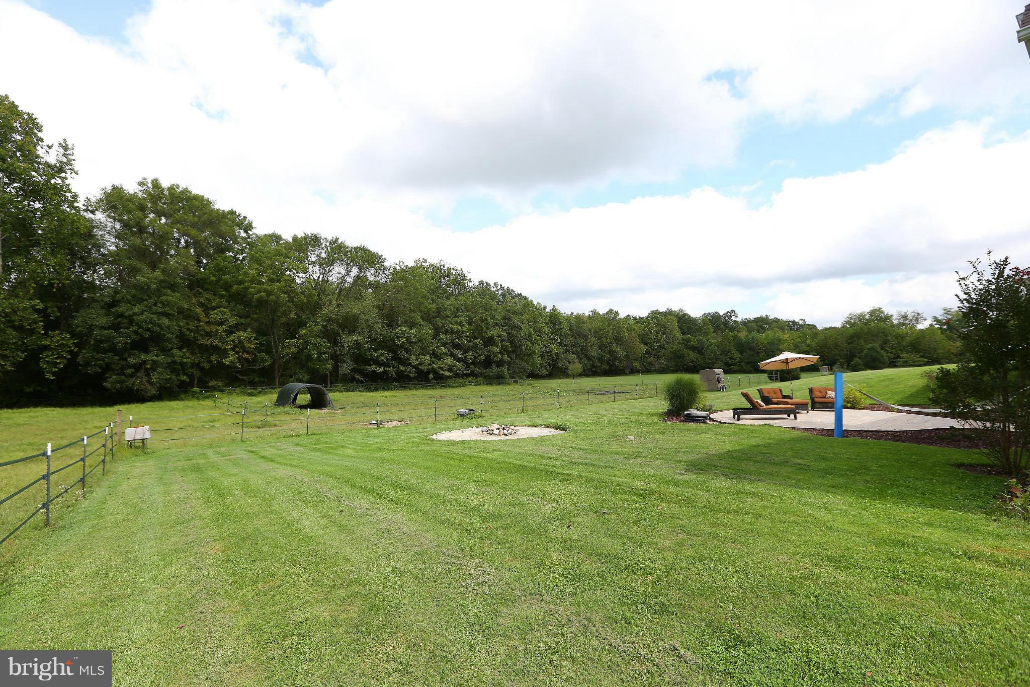 9360 Slate Quarry Road Dickerson, MD 20842 - Photo 25 of 27 a view of a golf course with huge green field and houses