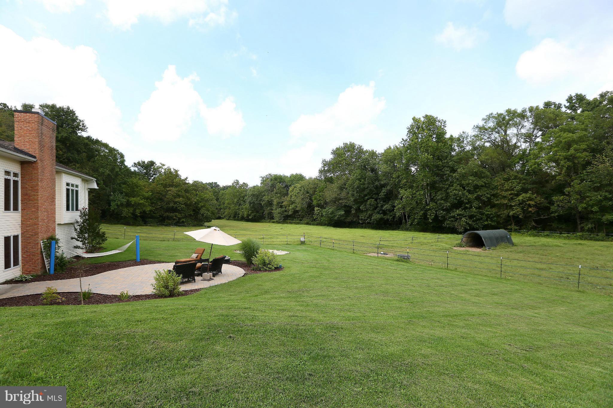 9360 Slate Quarry Road Dickerson, MD 20842 - Photo 27 of 27 a view of outdoor space with deck and yard