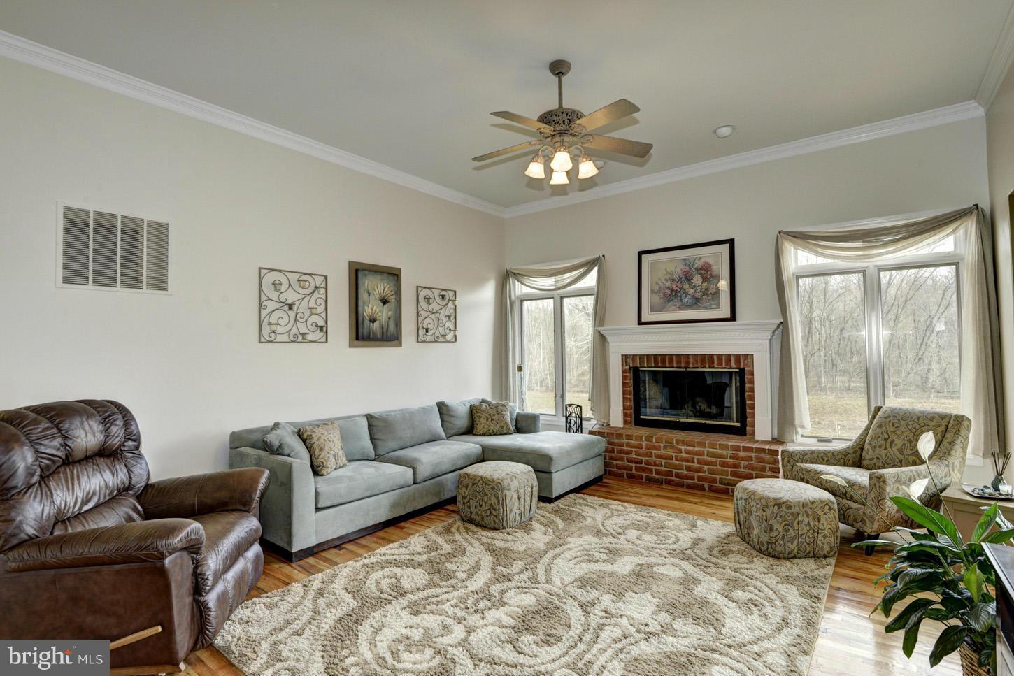 9360 Slate Quarry Road Dickerson, MD 20842 - Photo 6 of 27 a living room with furniture and a fireplace