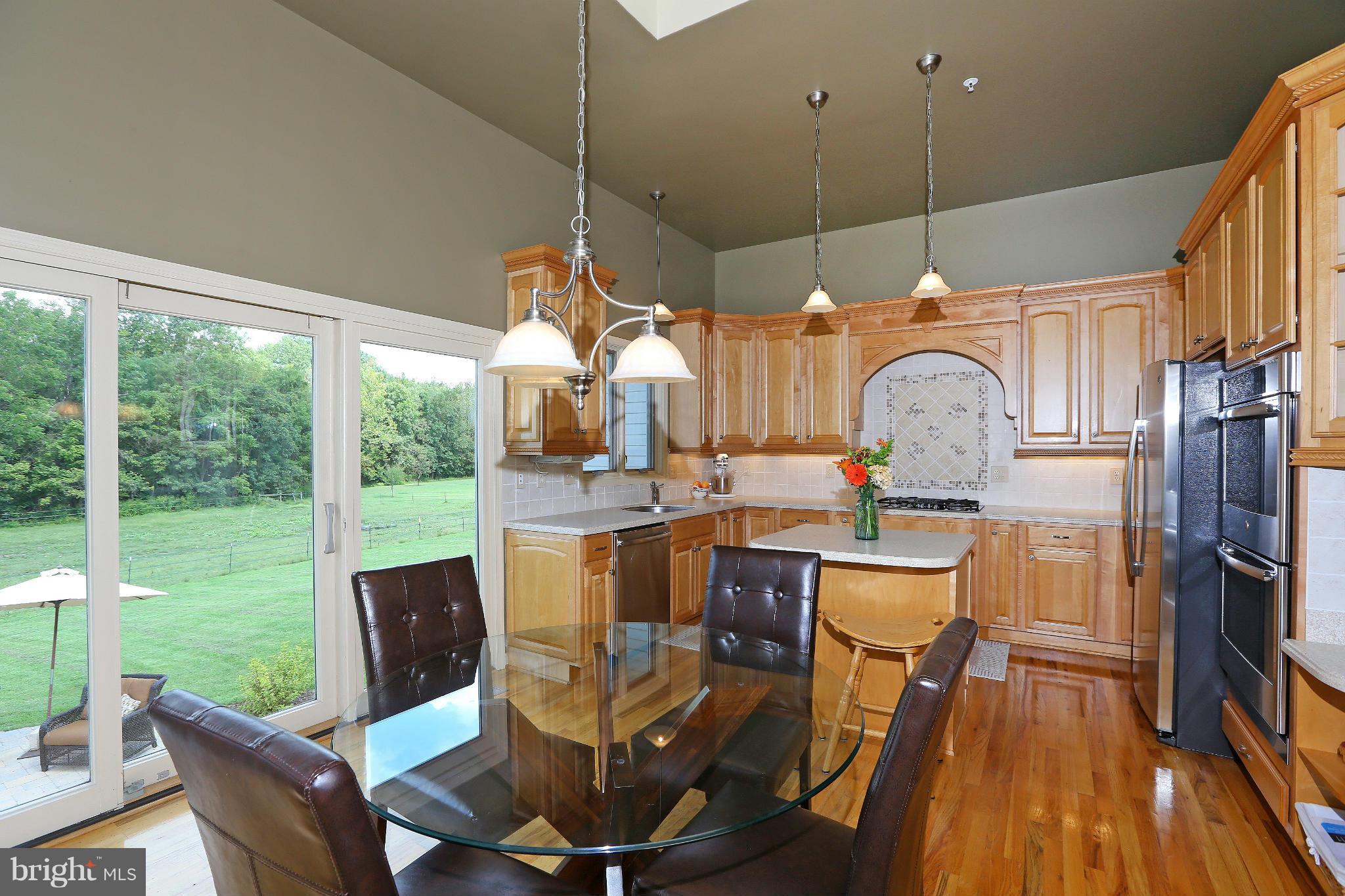 9360 Slate Quarry Road Dickerson, MD 20842 - Photo 8 of 27 a dining room filled with furniture and a floor to ceiling window
