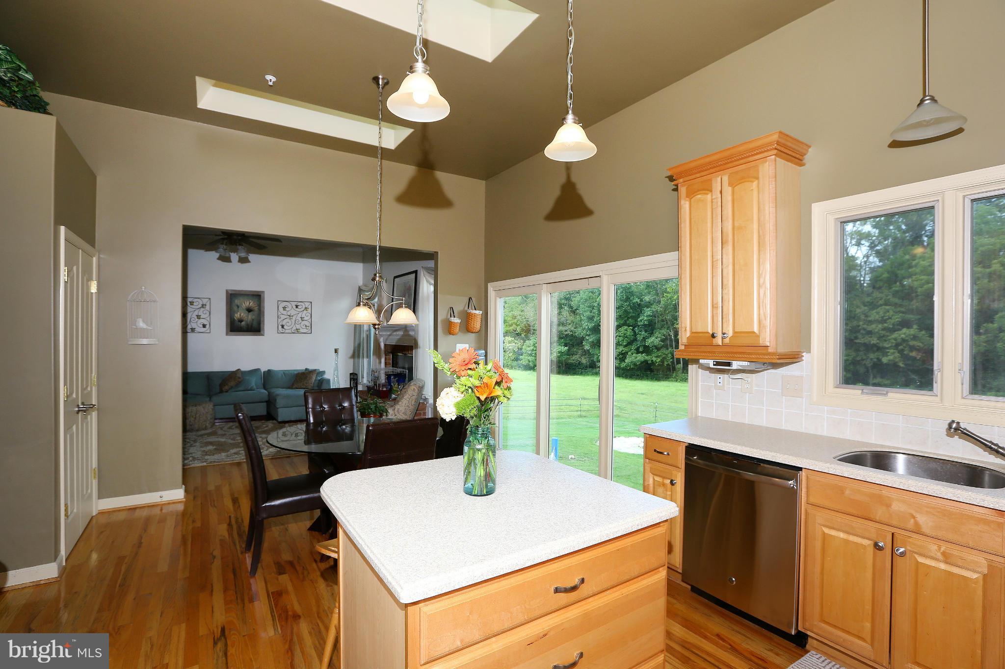 9360 Slate Quarry Road Dickerson, MD 20842 - Photo 9 of 27 a kitchen with a table chairs and a view of living room
